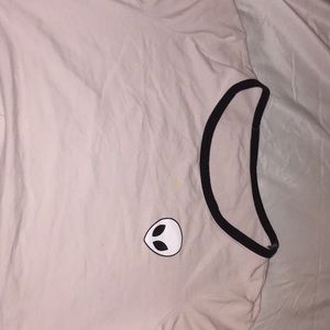 Light pink crop top with a zumiez logo